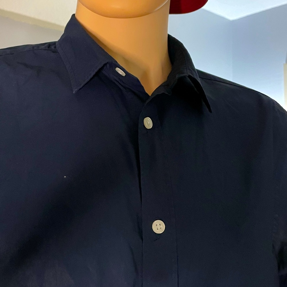 Navy blue button down slim fit shirt.